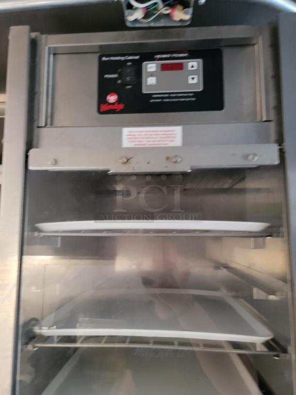 Henny Penny Evolution fryer in Texino food trailer. Features digital controls and interior racks, ideal for high-volume cooking.