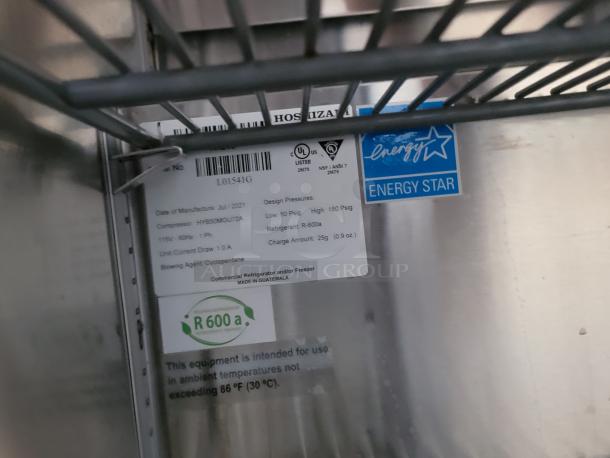 Tag inside Hoshizaki refrigeration unit showing Energy Star certification and R-600a refrigerant details.