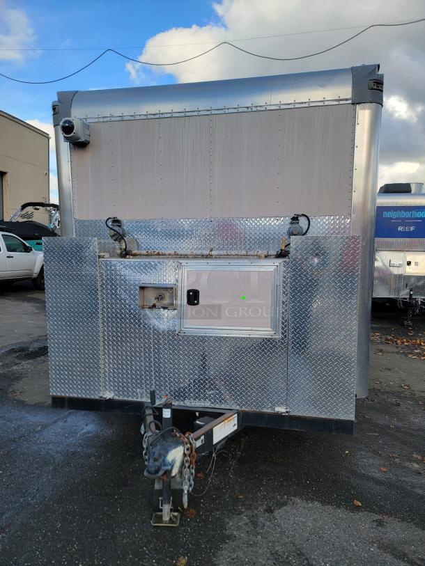 24' Quality food trailer, stainless steel, Turbo Air refrigeration, ready for service. Professional-grade equipment, exterior view.