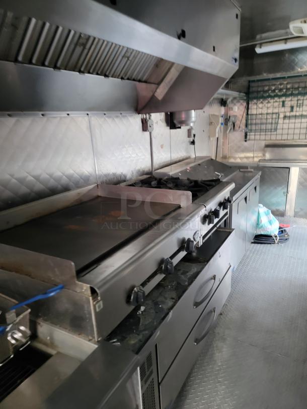 24' Quality food trailer with stainless steel build, Turbo Air refrigeration, and NSF-certified equipment for efficient service.