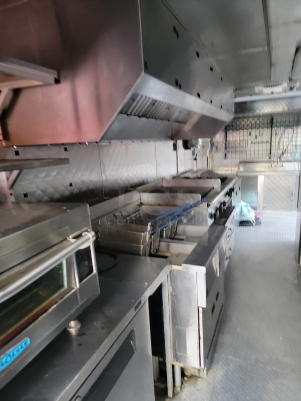 Fully equipped 24' Quality food trailer with stainless steel kitchen, Turbo Air refrigeration, NSF-certified equipment.