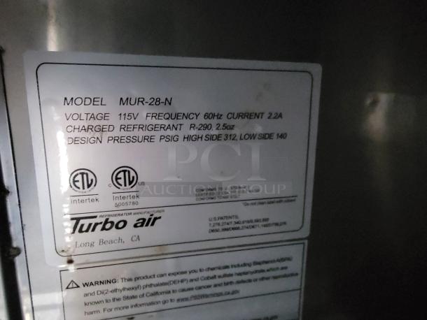 Sticker on Turbo Air refrigeration unit model MUR-28-N, showing voltage 115V, frequency 60Hz, and refrigerant R-290 details.