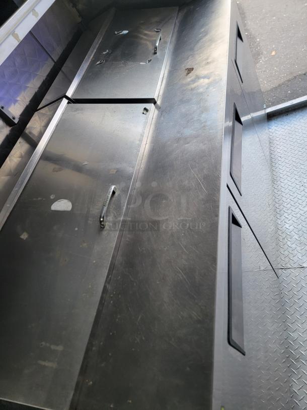 Stainless steel interior of a 24’ Quality food trailer, showing durable counters and storage, ideal for high-volume use.