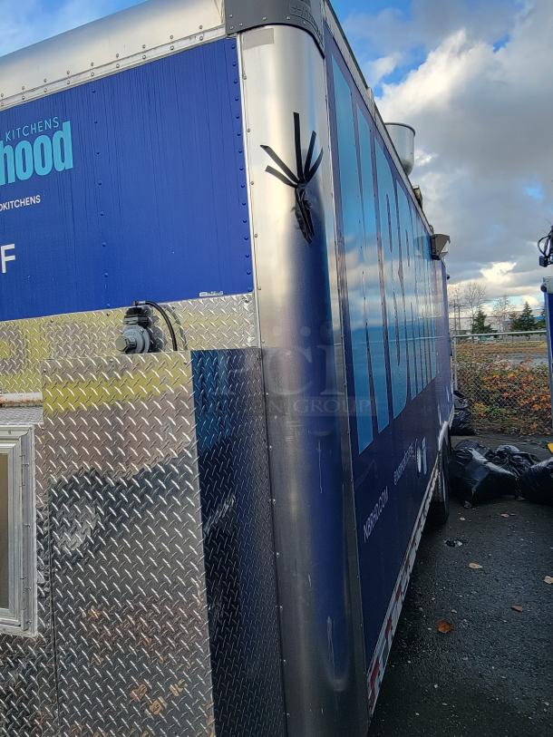 2020 24' Quality food trailer with diamond plate siding and blue graphics. Well-maintained, ready for business.