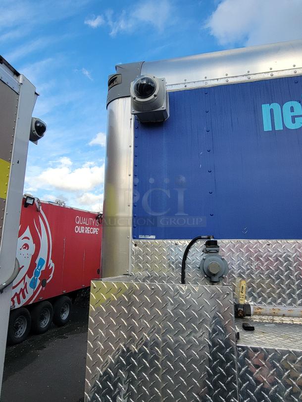 2020 24' Quality Food Trailer with diamond plate exterior, dome cameras, and utility connections; well-maintained condition.