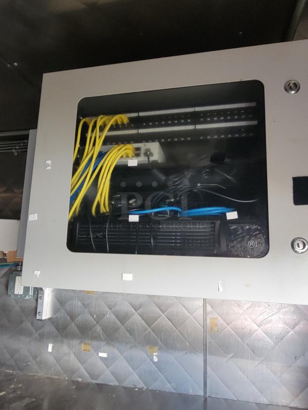 Electrical panel inside a 2020 Quality 24' food trailer, showing organized yellow and blue wiring.