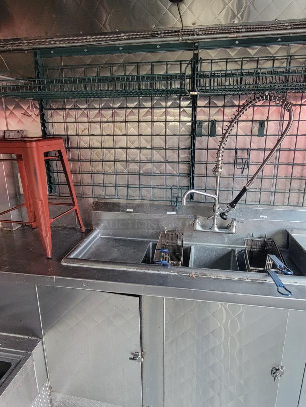 2020 24' Quality Food Trailer interior with stainless steel sink, storage, and commercial faucet; ready-to-use condition.