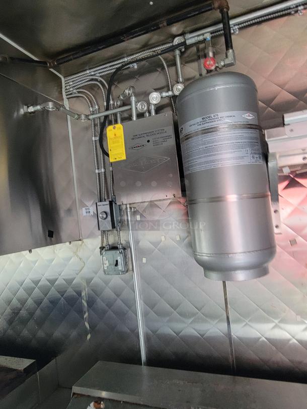 2020 Quality 24' food trailer interior with fire suppression system, well-maintained and ready for immediate business use.