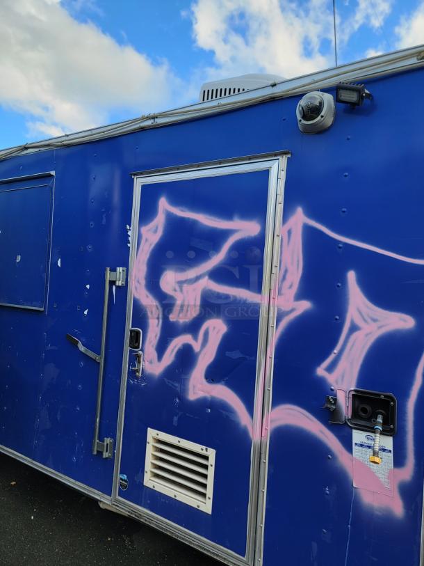 2019 Quality 24' Food Trailer, blue exterior with pink graffiti, empty interior, clean slate for customization.