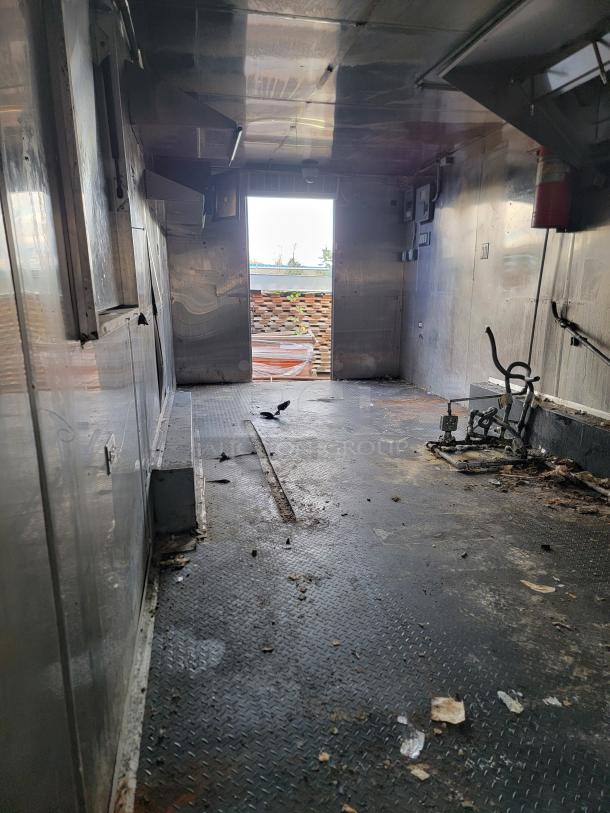 2019 Quality 24' empty food trailer interior, ready for custom design; suitable for various food ventures. Clean slate condition.