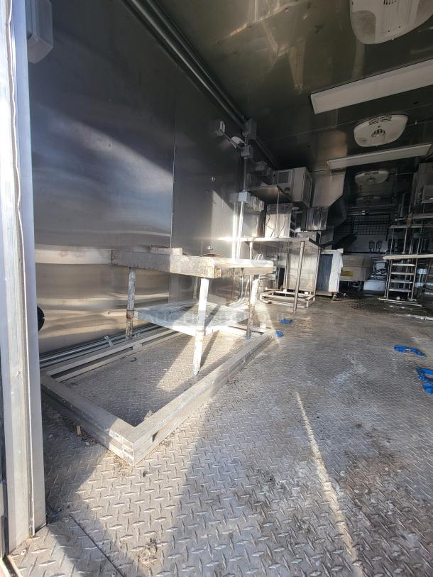 2021 Texino 28' food trailer interior, stainless steel, ready for high-volume operation with premium electric equipment.