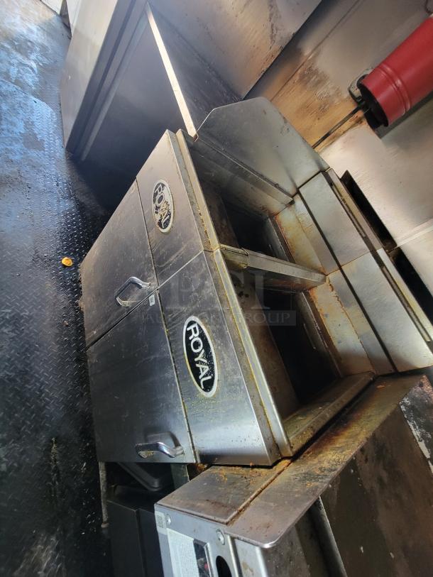 Royal Range RFT-50 Natural Gas deep fryer in food truck, showing steel exterior with visible usage signs, branded "Royal."