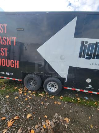 2021 mobile ghost kitchen trailer with dual axles and "lightspeed" branding, used for high-volume delivery fulfillment.