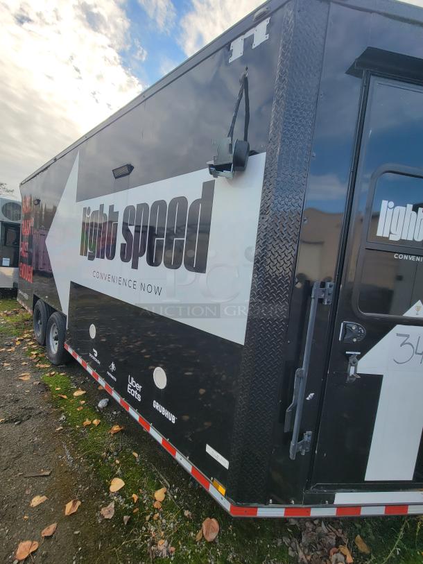 20' 2021 SDG Mobile Ghost Kitchen Trailer, dual-axle, Lightspeed setup, used for delivery, logos visible, good condition.