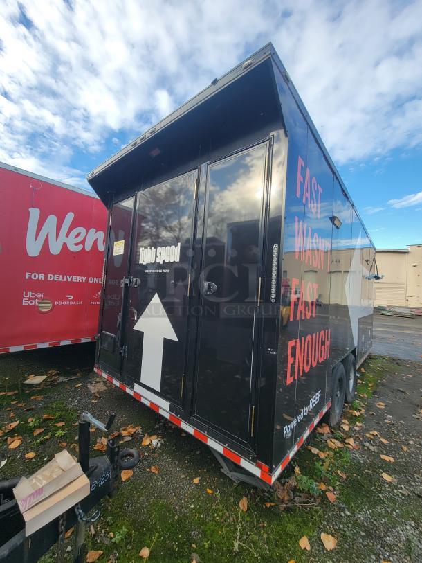 2021 SDG 20' mobile ghost kitchen trailer, black with "light speed" and "FAST WASN'T FAST ENOUGH" markings, dual-axle.