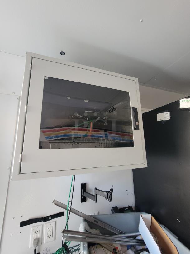 Interior view of 2021 SDG 20' mobile trailer, featuring a wall-mounted equipment cabinet. Ideal for ghost kitchen setup.