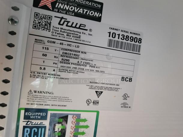 Label from True Refrigeration with model GDM-45-HC-LD. Includes voltage, compressor info, and warning details.