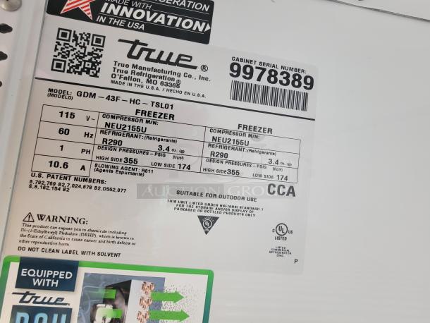 Label on a True Manufacturing freezer, Model GDM-43F-HC-TSL01, showing specs like voltage, refrigerant type R290, and compressor details.