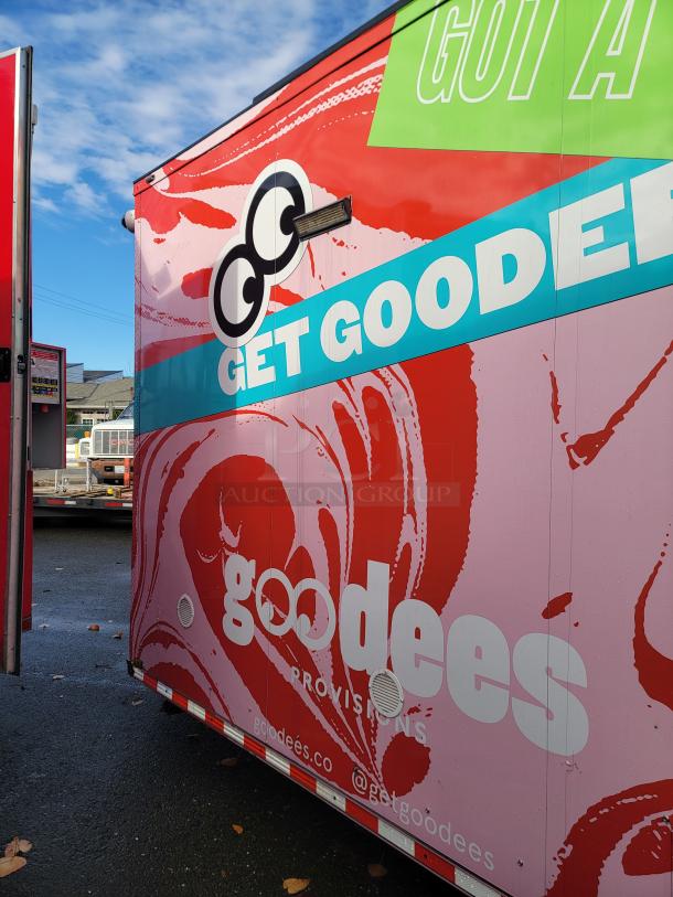 2021 SDG Ghost 20' food trailer with bright, eye-catching graphics, featuring brand "Goodees Provisions" on the side.