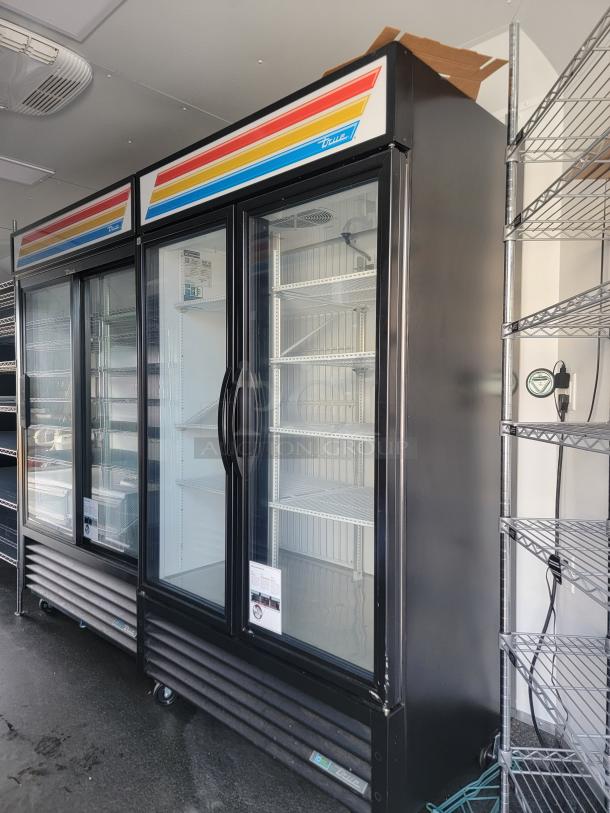 2021 SDG Ghost 20' Food Trailer interior with True commercial refrigeration units. Clean, stainless workspace, eco-friendly R290 refrigerant.