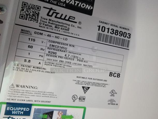Label inside 2021 SDG Ghost Food Trailer showing True Refrigeration model GDM-45. Details include R290 refrigerant and specs.