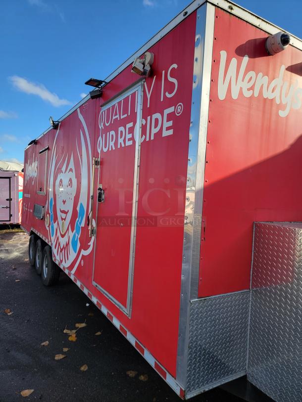 28' Rock Solid Cargo mobile kitchen trailer, red with Wendy's branding, professional stainless steel exterior, fully equipped.
