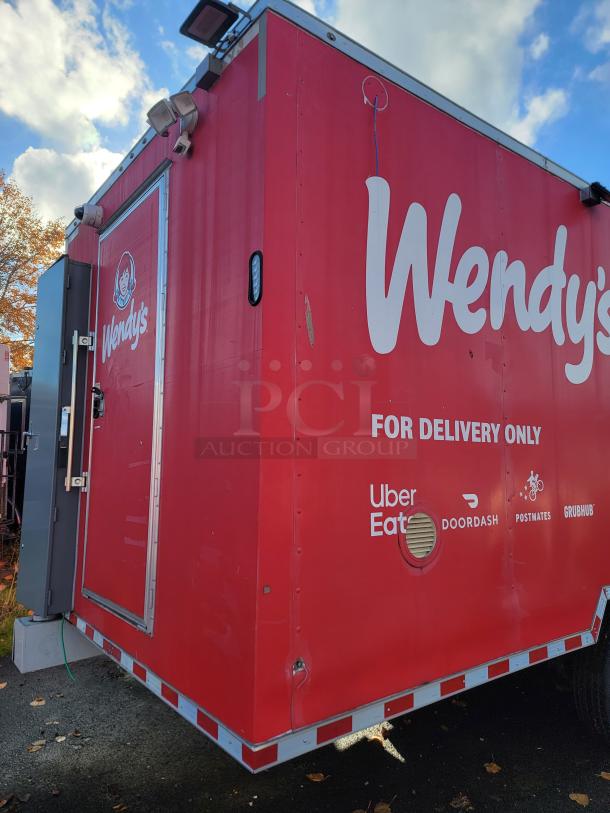 28' Rock Solid Cargo mobile kitchen trailer, red with Wendy's branding. Equipped for high-volume food service, 2021 model.