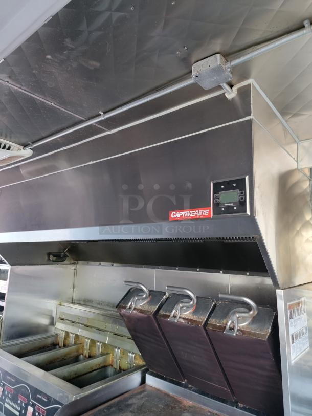 2021 28' Rock Solid Cargo food trailer interior with CaptiveAire hood, Henny Penny fryers, ready for high-volume use.