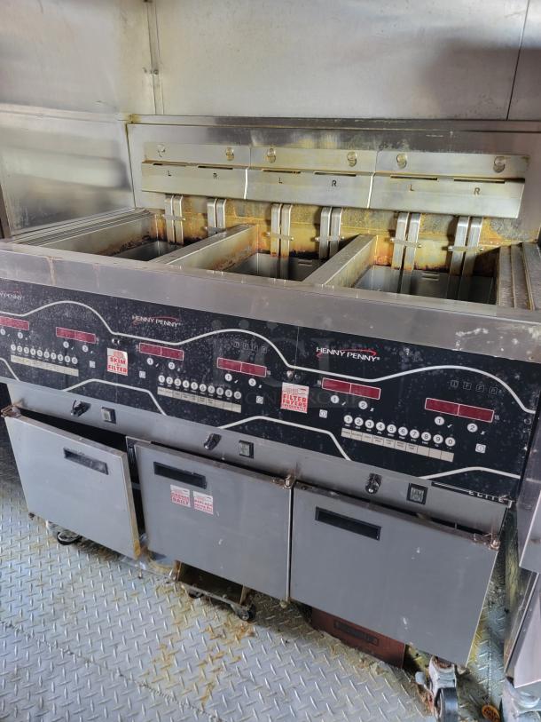 Henny Penny fryers inside 2021 Rock Solid Cargo 28' mobile kitchen trailer, stainless steel, fully equipped, ready for operation.