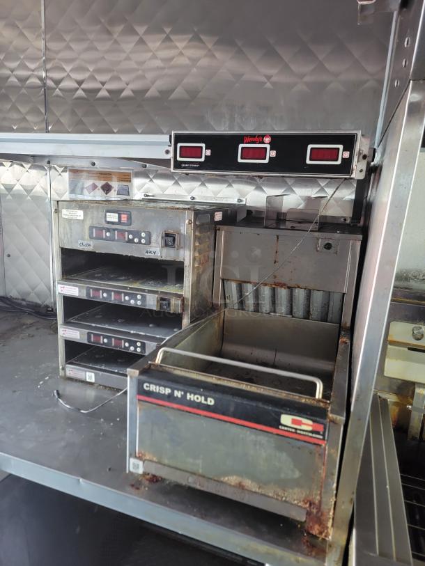 28' mobile kitchen trailer with Wendy's commercial appliances, including Henny Penny fryers and Crisp N' Hold. Used condition.