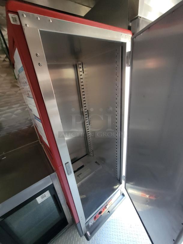Interior view of the 2021 Rock Solid Cargo 28' Mobile Kitchen Trailer, featuring commercial-grade stainless steel equipment and fixtures.