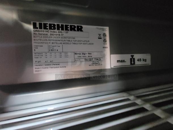 Label inside Liebherr bottle cooler, model GRB05S1HC, showing specifications and capacity of 45 kg.