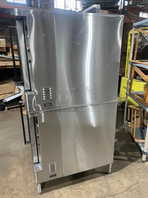 Blodgett stainless steel double-stacked convection oven, electric powered, with thermostatic control, wired rack, on legs.