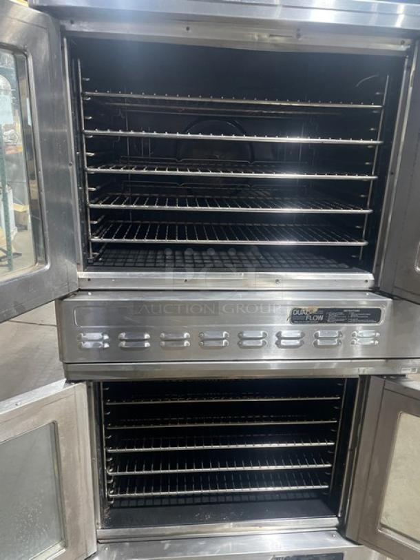 Blodgett stainless steel double stacked convection oven, electric powered, thermostatic control, wired racks, on legs.
