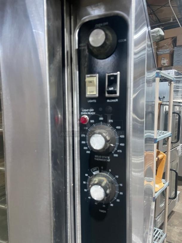 Blodgett double-stacked convection oven; stainless steel; electric; thermostatic control; wired rack; on legs.