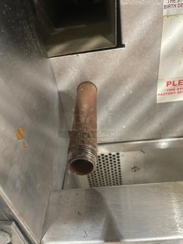 Blodgett stainless steel double convection oven, electric, thermostatic control, wired rack, on legs, interior view.