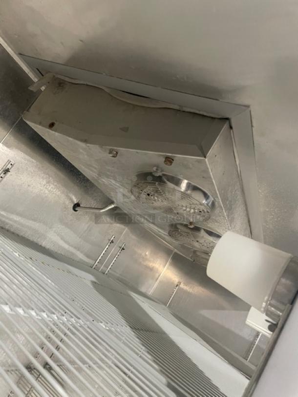 Continental 3F stainless steel reach-in freezer interior, featuring poly coated wire rack and fan. Model 3F, SN: 15466909.