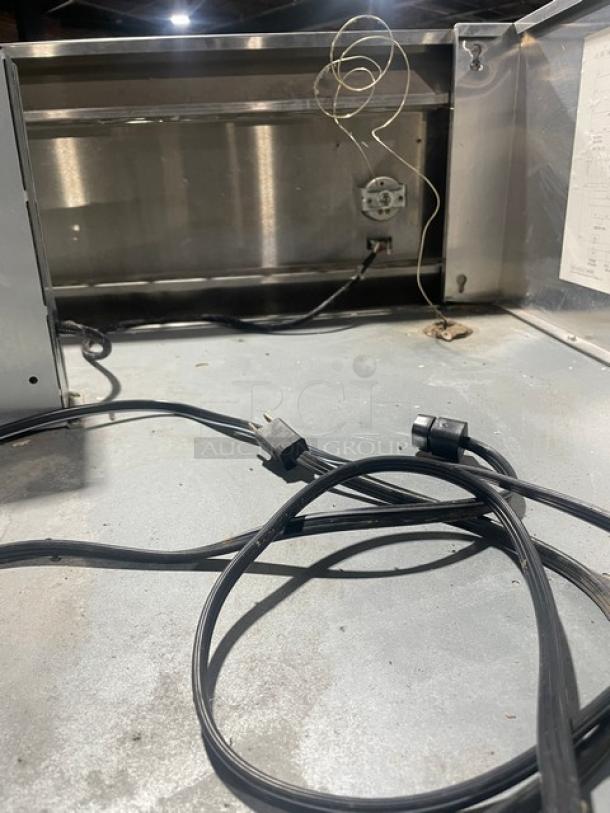 Continental 3F stainless steel 3-door reach-in freezer, Energy Star certified, on casters, with poly-coated wire rack, cords visible.