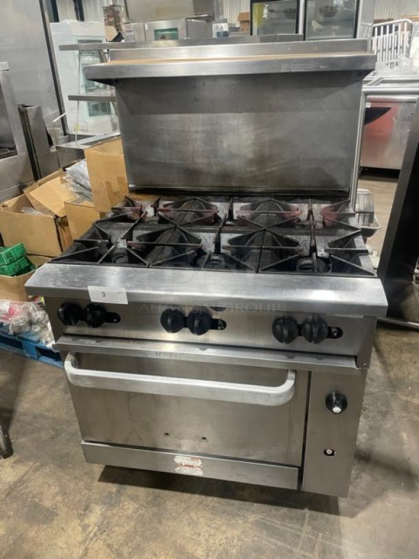 Vulcan stainless steel 6-burner gas stove with convection oven, model 36SF6BN, includes backsplash, salamander shelf, and casters.