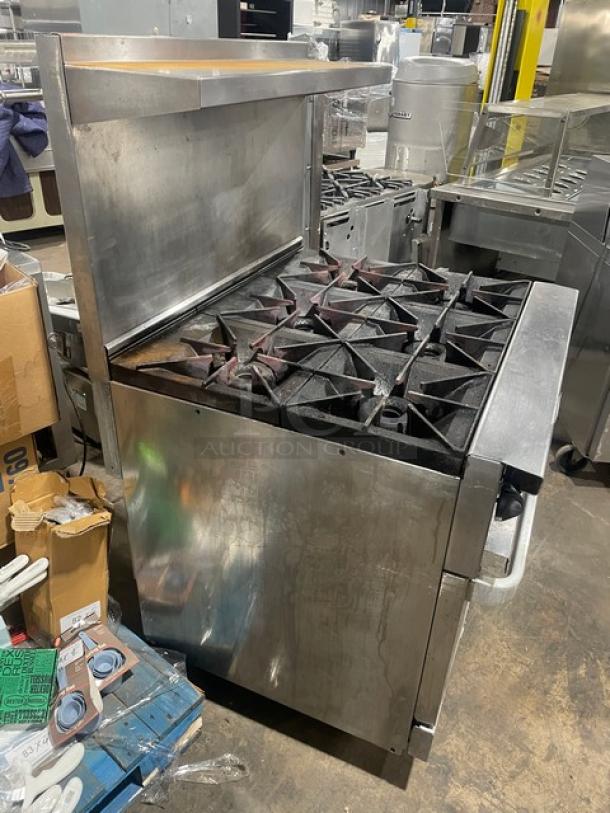 Vulcan 36SF-6BN stainless steel 6-burner gas stove with convection oven, backsplash, salamander shelf, and casters.