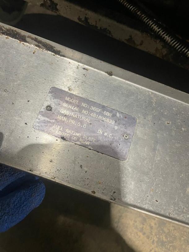 Stainless steel rating plate on Vulcan Commercial Stove, Model 36SF-6BN, Serial 481896832, indicating natural gas use.