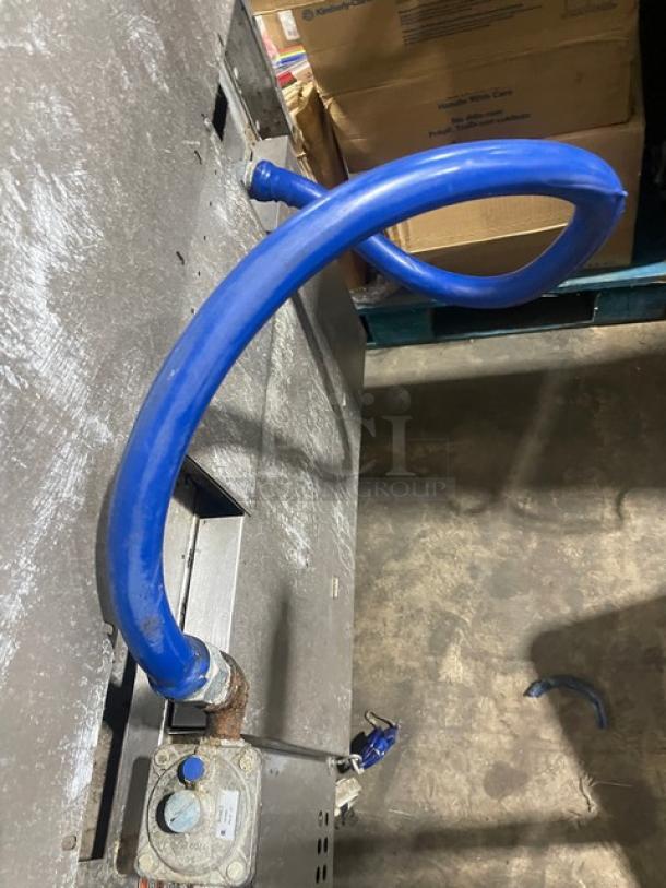 Vulcan commercial stainless steel stove with 6 burners, convection oven, backsplash, and salamander shelf. Model 36SF-6BN, on casters.