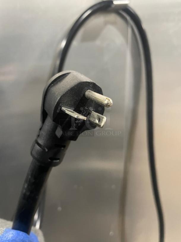 Black power plug for Carter-Hoffman HL3-18-35 food warmer, 120V, 1 Phase, visible against stainless steel background.