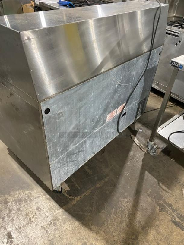 Silver King stainless steel 2-door refrigerated prep table, model SKEPT4812-SD-1-BM, with cutting board, on casters.