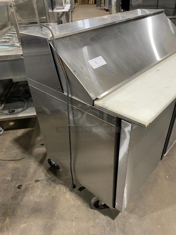 Silver King 2-door stainless steel prep table, Model SKEPT4812SD1BM, with cutting board, poly-coated rack, on casters.