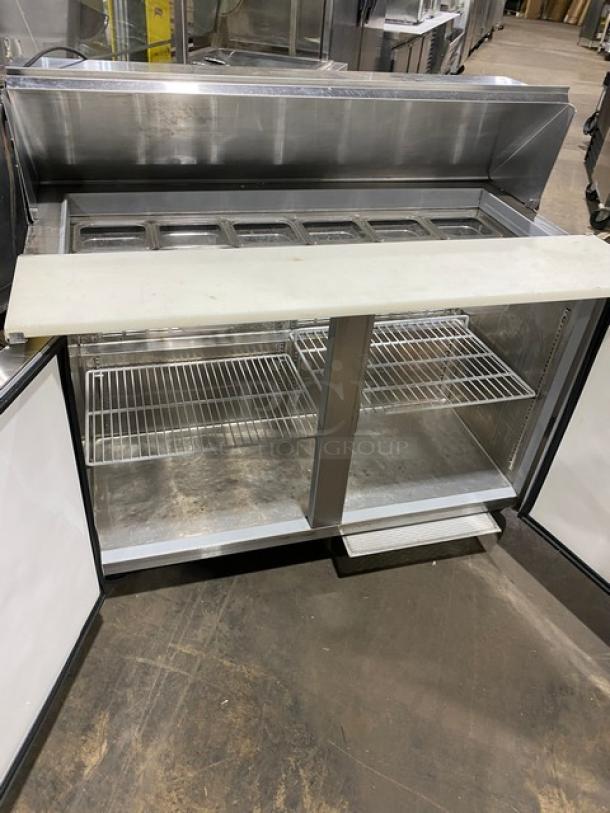 Silver King SKEPT4812-SD-1-BM stainless steel 2-door prep table with cutting board, poly-coated rack, on casters, excellent condition.