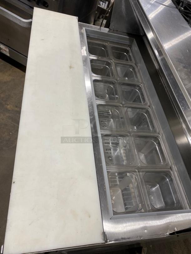 Silver King stainless steel 2-door refrigerated prep table, Model SKEPT4812SD1BM, with cutting board, wire rack, on casters.