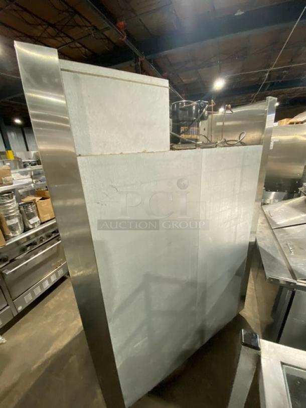 Traulsen Spec Line Series stainless steel half-door double section reach-in refrigerator, model AHT232WUTHHS, with chrome racks and pan slides, on casters.