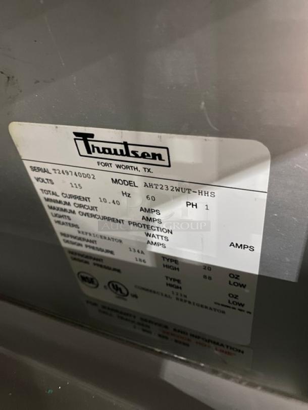 Traulsen Spec Line Series stainless steel half-door fridge, Model AHT232WUTHHS. Features chrome rack, pan slides, on casters. Serial T249740D02. 115V, 1 phase.