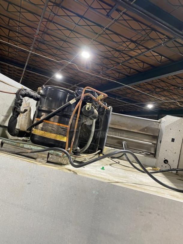 Traulsen Spec Line commercial stainless steel half-door refrigerator compressor. Model AHT232WUTHHS, 115V, on casters.